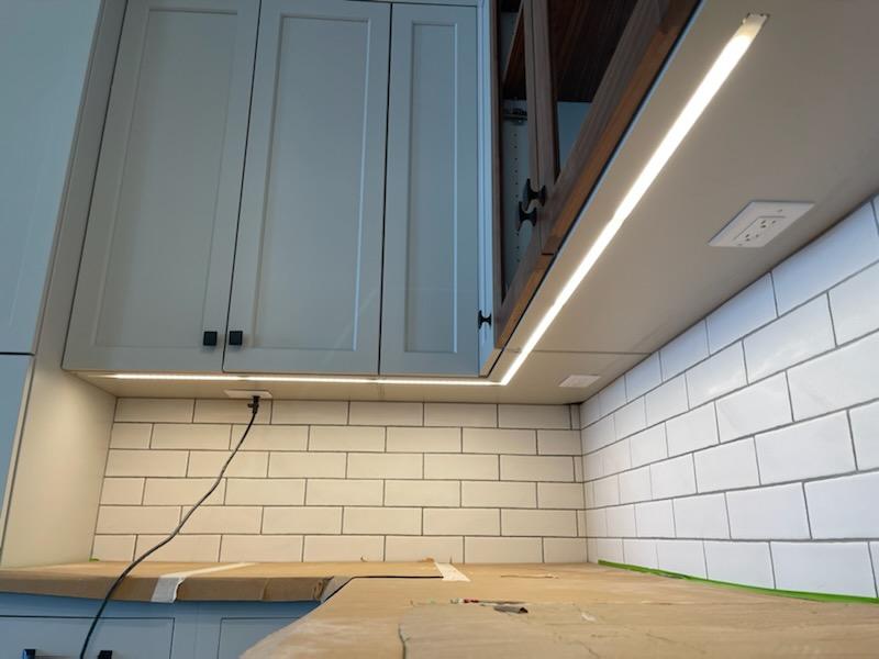 Premium LED undercabinet lighting installation in a West Michigan kitchen for improved task lighting and ambiance