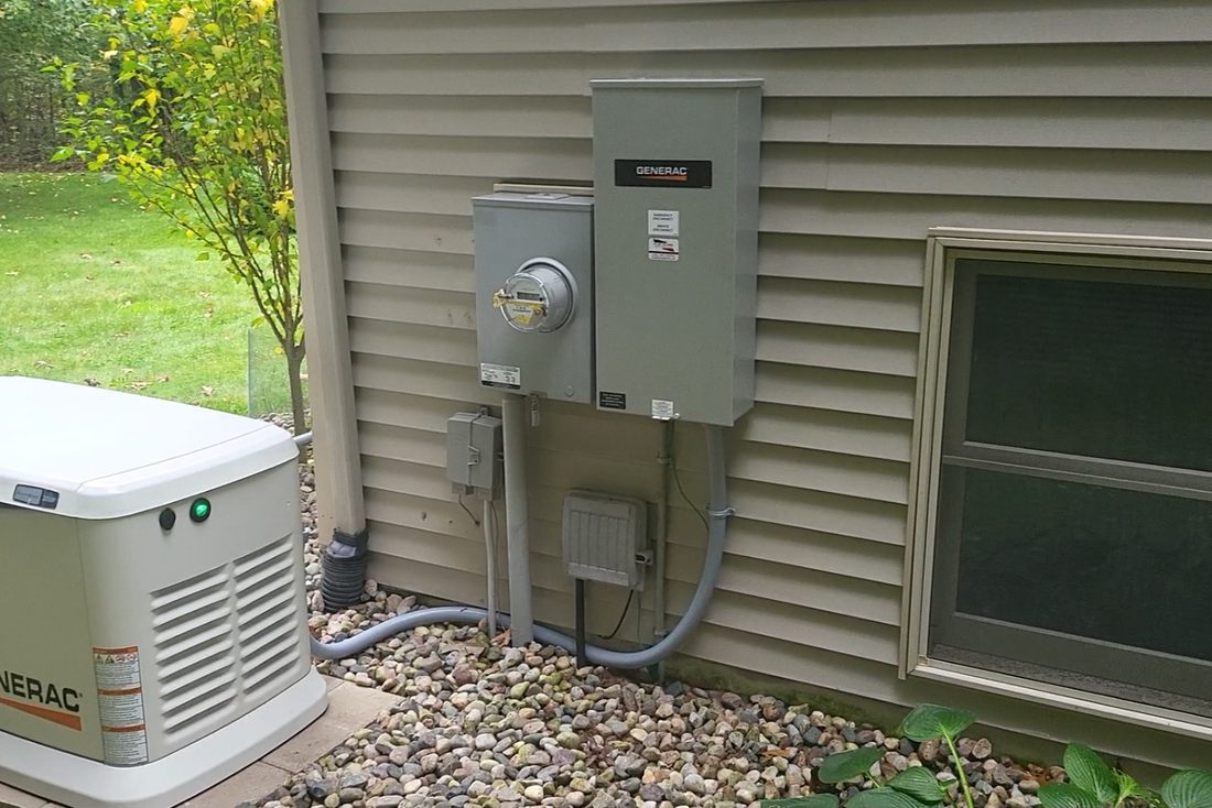 Generac generator, meter and automatic transfer switch neatly installed on a West Michigan home